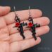 Серьги Крест из кольев с розой черного цвета